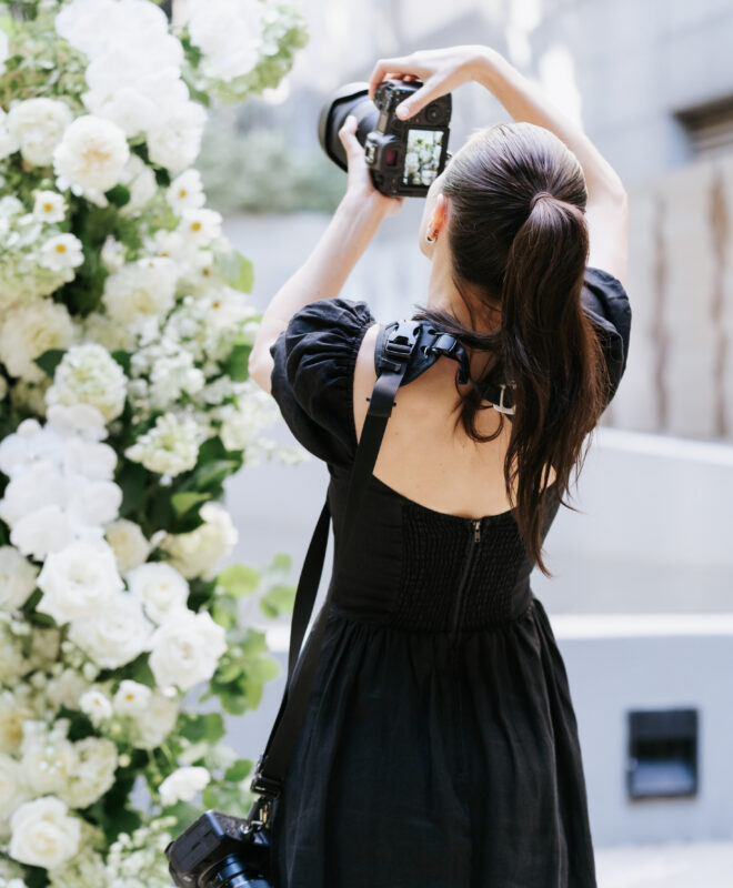 Our talented team of photographers at Art of Grace capturing the beauty of the ceremony floral setup in all its elegance.