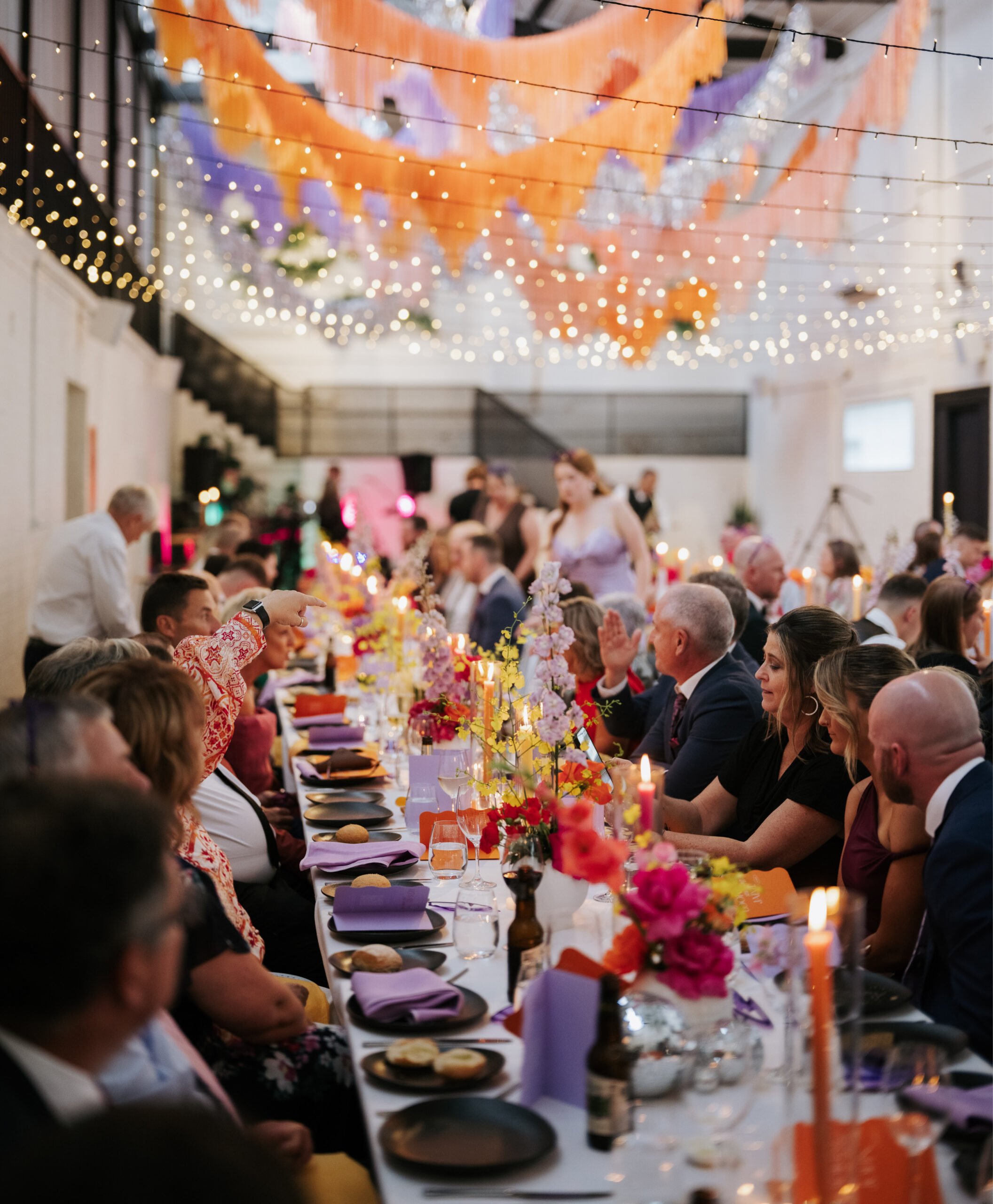A beautifully styled reception at The Wool Mill, with exquisite floral arrangements by Anatomy of Flowers and expert styling by The Goodsmiths, creating a memorable atmosphere for guests to dine and celebrate.