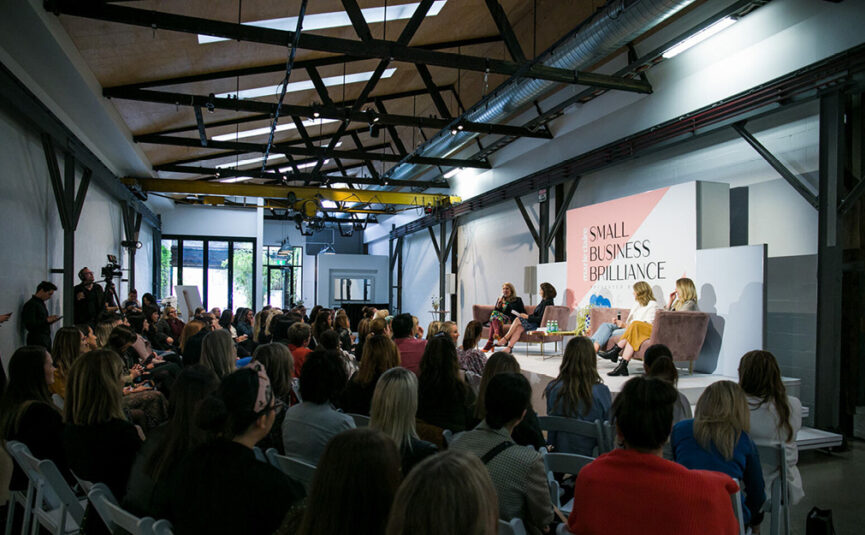 Two Ton Max filled with guests listening to a speaker event.